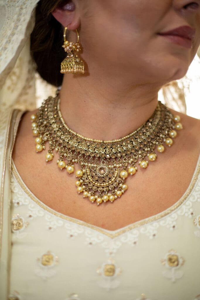 Brooklyn Nikkah Elopement. Close up of bride's full jewelry and henna before the ceremony.