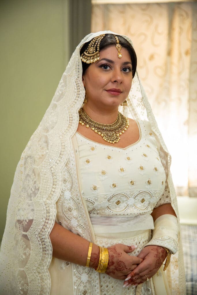 Brooklyn Nikkah Elopement. Portrait of bride in full jewelry and henna before the ceremony.