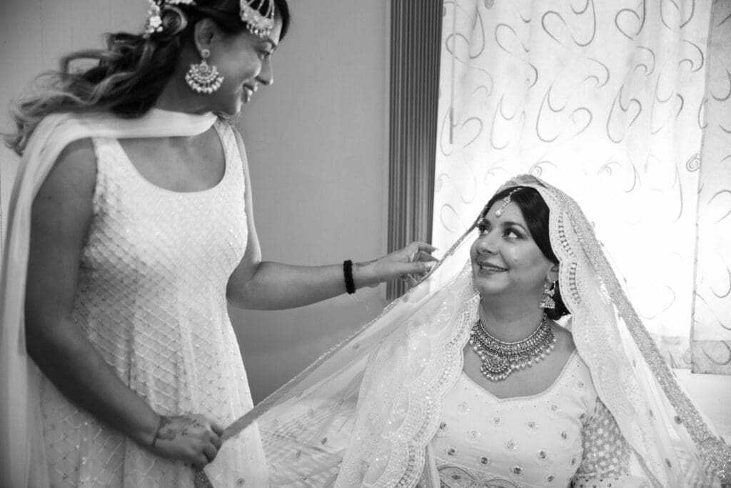 Brooklyn Nikkah Elopement. Portrait of bride and sister before the ceremony in her full jewelry and henna.