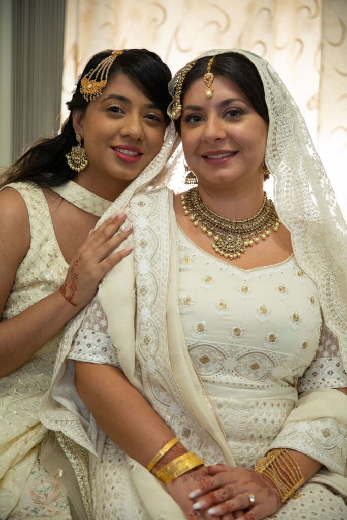 Brooklyn Nikkah Elopement. Portrait of bride and sister before the ceremony in her full jewelry and henna.