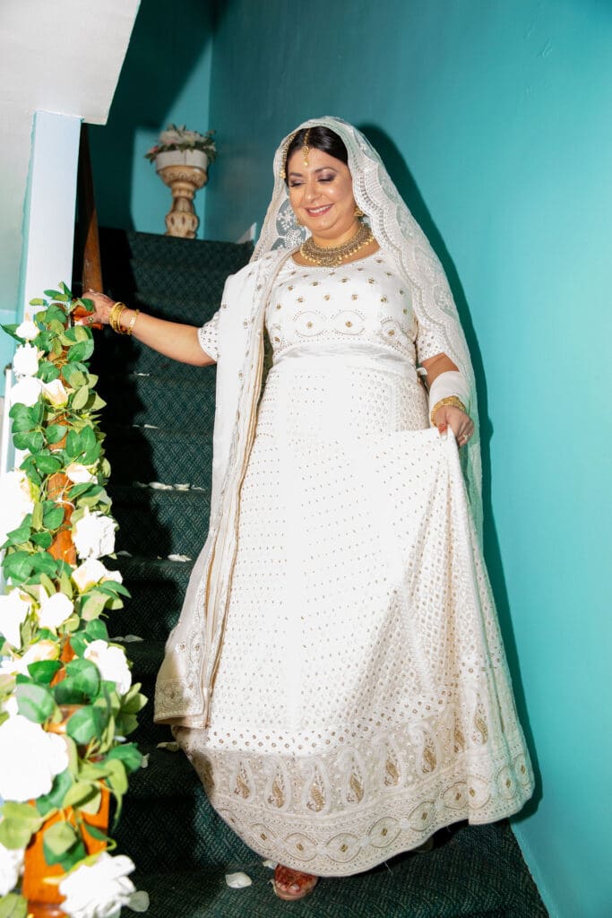 Brooklyn Nikkah Elopement. Bride coming down the stairs to the ceremony.