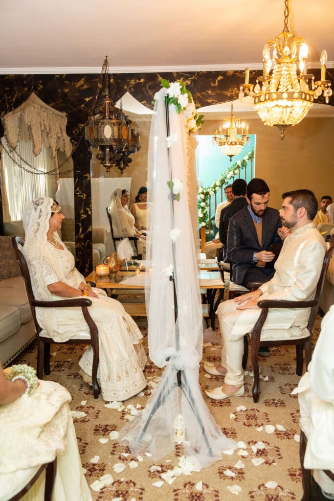 Brooklyn Nikkah Elopement. Side view of the groom and bride looking at the partition.