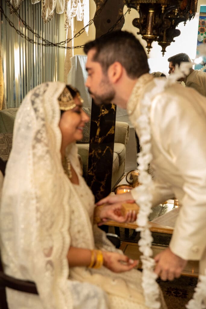 Brooklyn Nikkah Elopement with groom kissing bride on forehead.