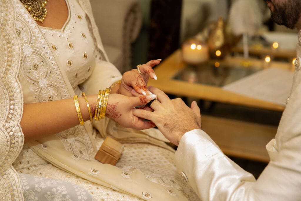 Brooklyn Nikkah Elopement with Imam leading ceremony and close up of ring exchange.