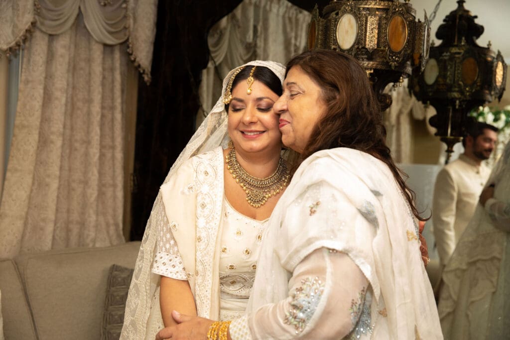 Brooklyn Nikkah Elopement with bride embracing her mother.
