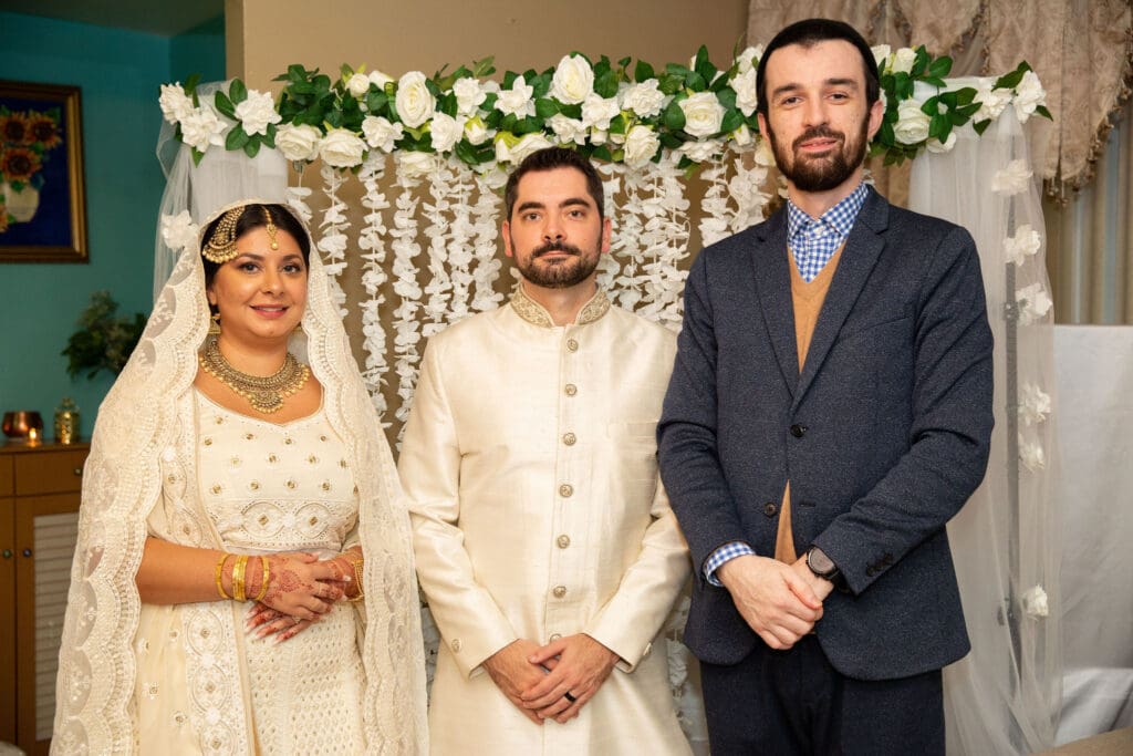 Brooklyn Nikkah Elopement with newlyweds posing for a portrait with Imam.