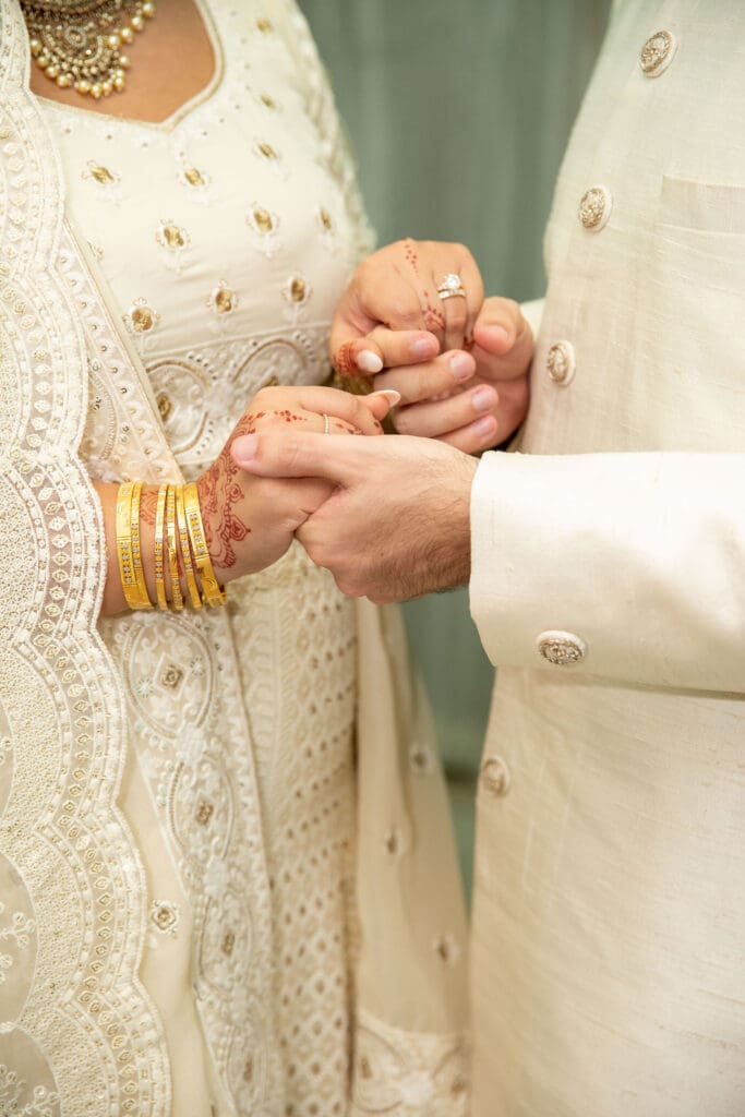 Brooklyn Nikkah Elopement - a closeup of newlyweds holding hands.