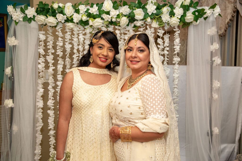 Brooklyn Nikkah Elopement with bride and her sister smiling for the camera.