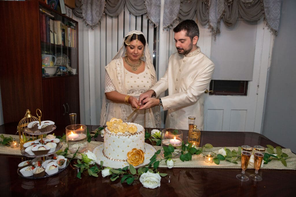 Brooklyn Nikkah Elopement with newlyweds cutting their cake.