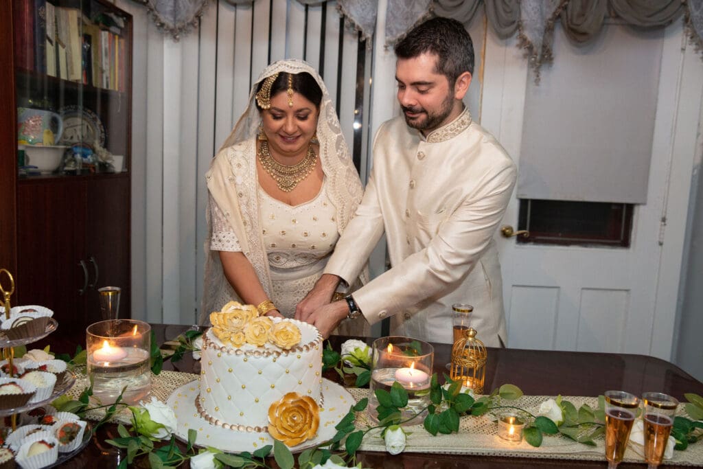 Brooklyn Nikkah Elopement with newlyweds cutting their cake.