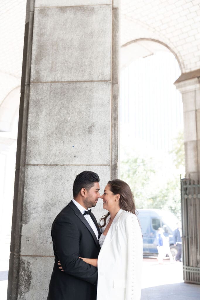 Newlywed couple celebrate with wedding portraits in NYC after getting married at City Hall.