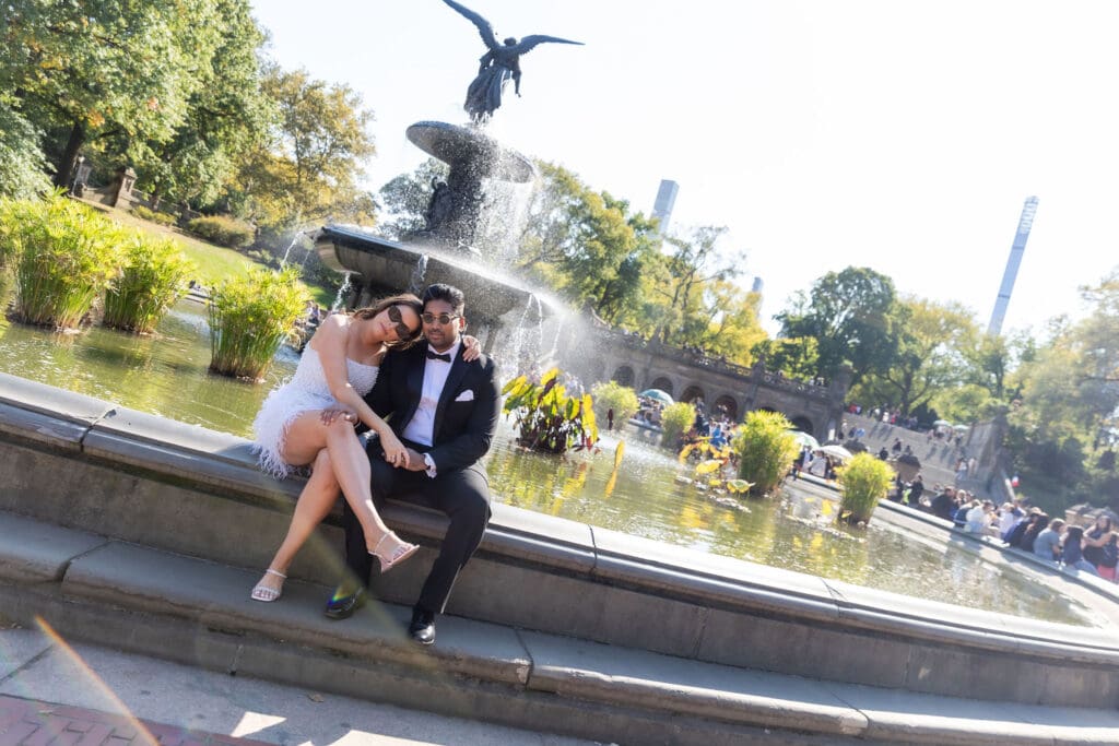 Newlywed couple pose at Bethesda Terrace in Central Park NYC after getting married at City Hall.