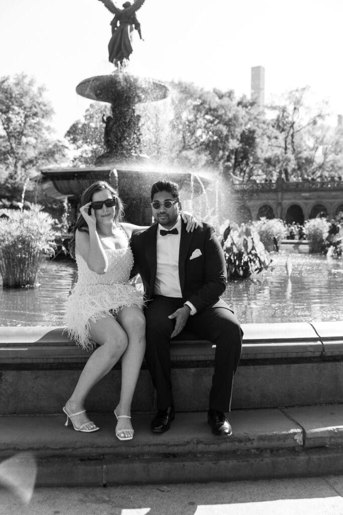 Newlywed couple pose at Bethesda Terrace in Central Park NYC after getting married at City Hall.