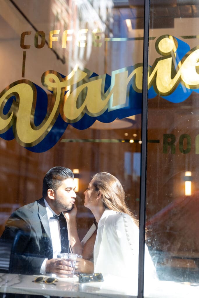 Newlywed couple gets coffee at Variety Coffee in NYC after getting married at City Hall.