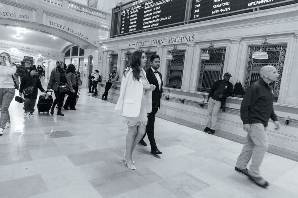 Fancy Newlywed UK couple walk through Grand Central Station in NYC after getting married at City Hall.