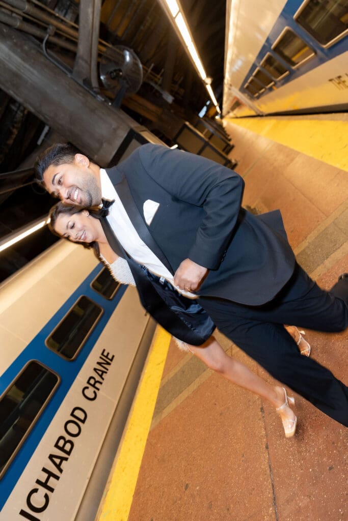 Fancy Newlywed UK couple run on train platform inside Grand Central Station in NYC after getting married at City Hall.