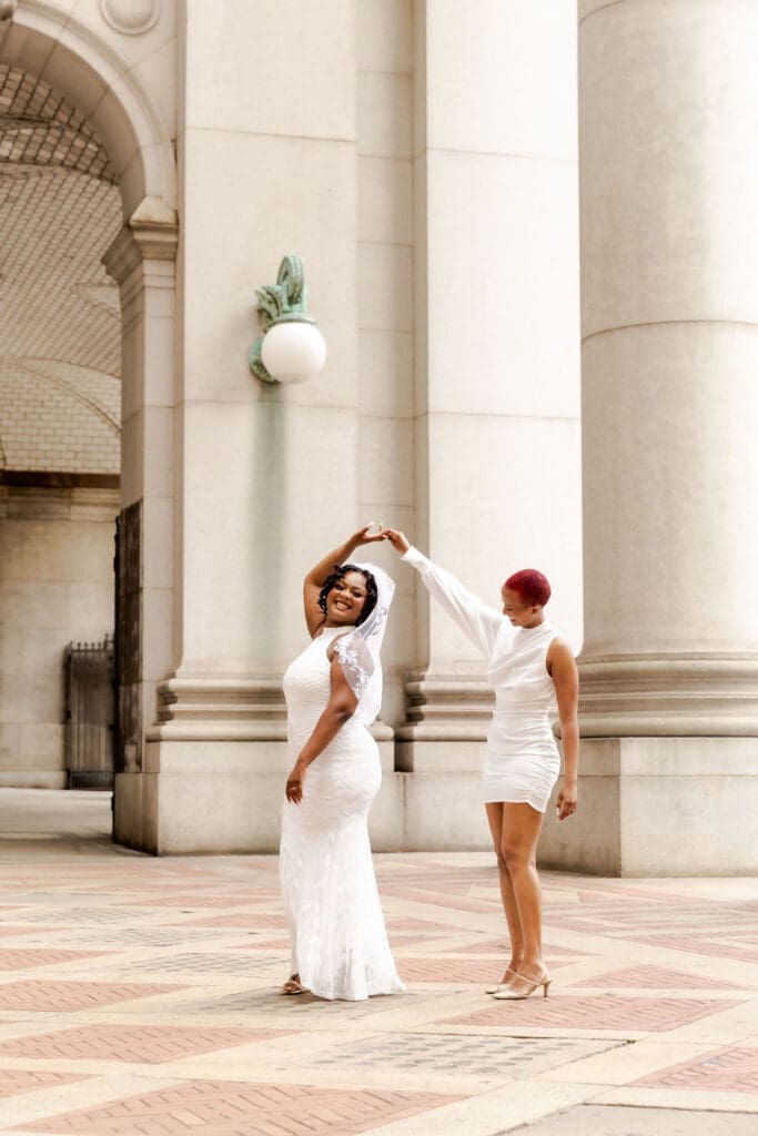 Two brides dance in NYC after getting married at City Hall.