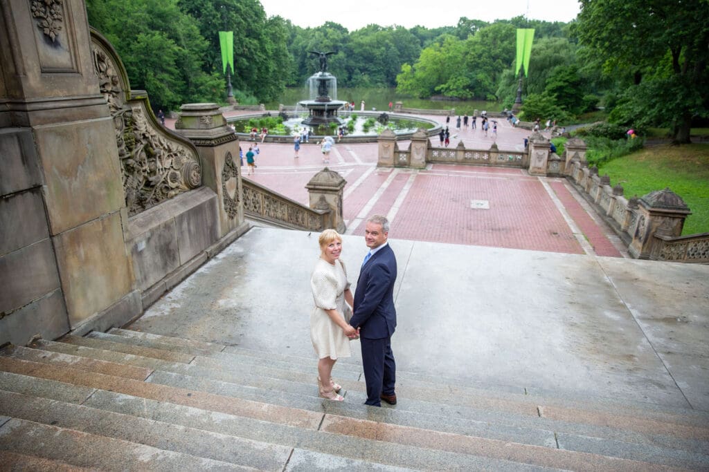 NYC Elopement in Central Park after after ceremony at the Norwegian Seamen's Church. Bride and groom take portraits at Bethesda Terrace.