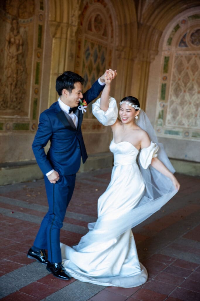 Newlyweds dance at the Arcade at Bethesda Terrace in NYC's Central Park.