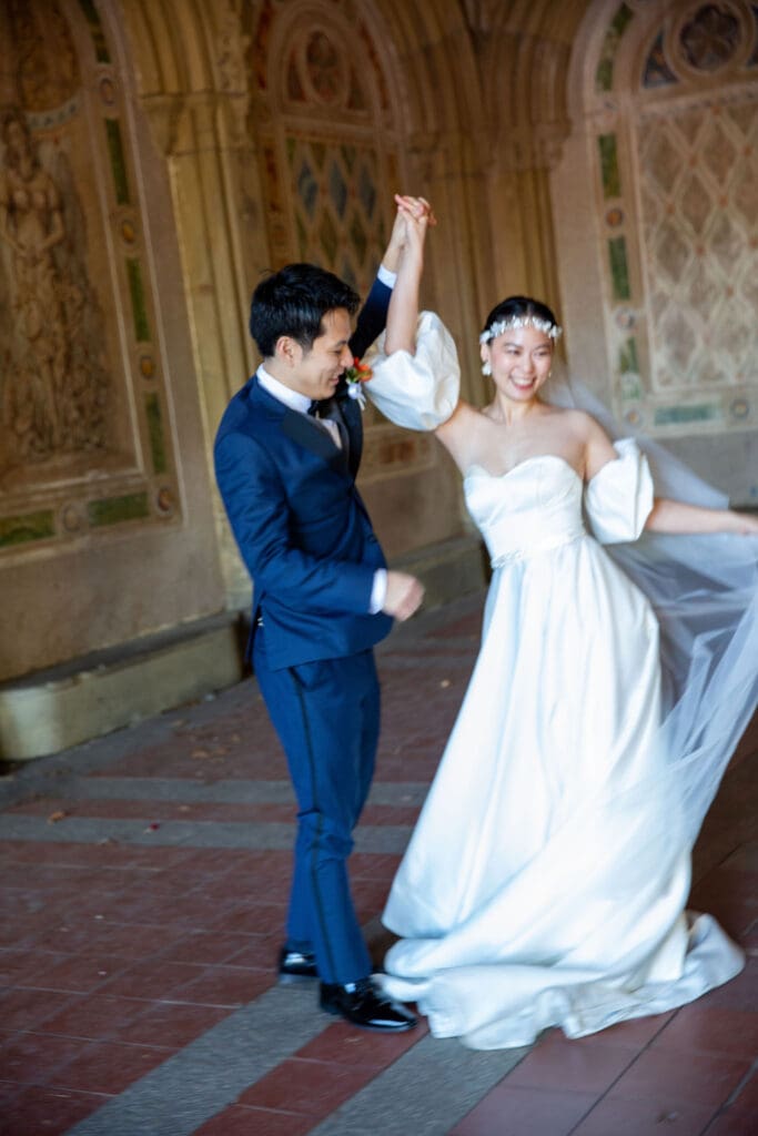 Newlyweds dance at the Arcade at Bethesda Terrace in NYC's Central Park.