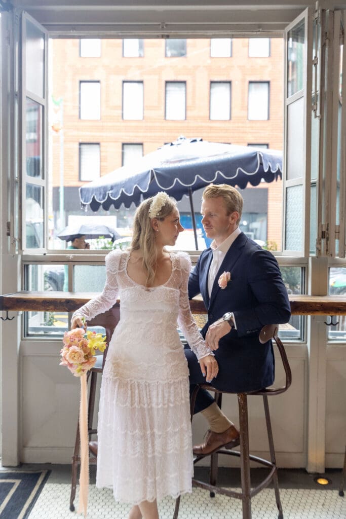 Newlyweds relax at a bar in NYC's Little Italy.