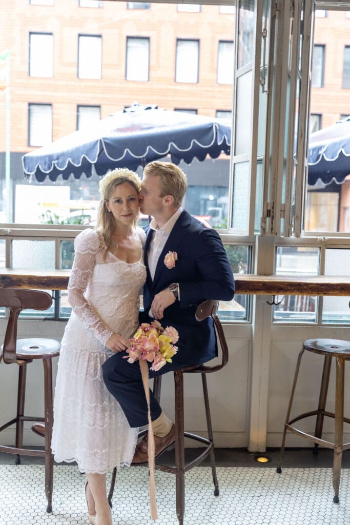 Newlyweds relax at a bar in NYC's Little Italy.