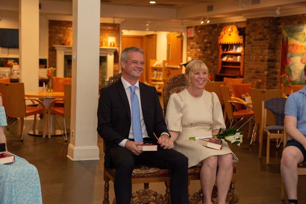 NYC Elopement at the Norwegian Seamen's Church. Bride and Groom smile during ceremony.