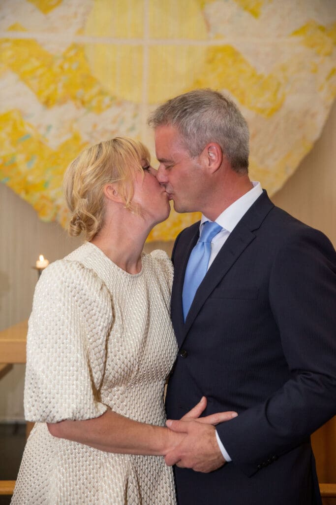NYC Elopement at the Norwegian Seamen's Church. Bride and Groom kiss after ceremony.