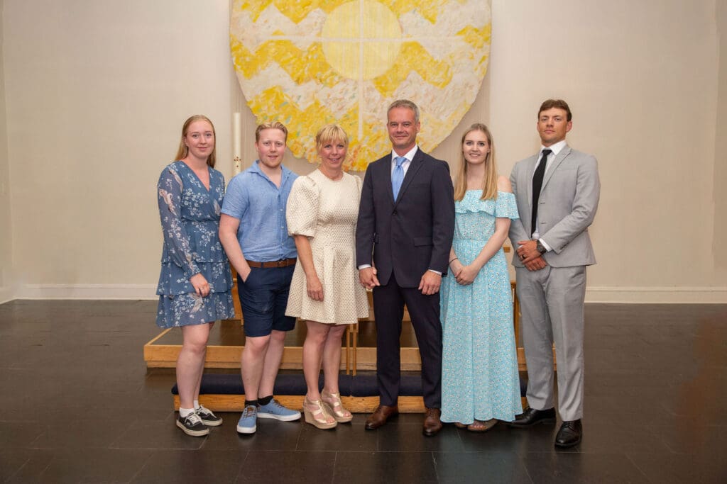 NYC Elopement at the Norwegian Seamen's Church. Bride and Groom pose with family after ceremony.