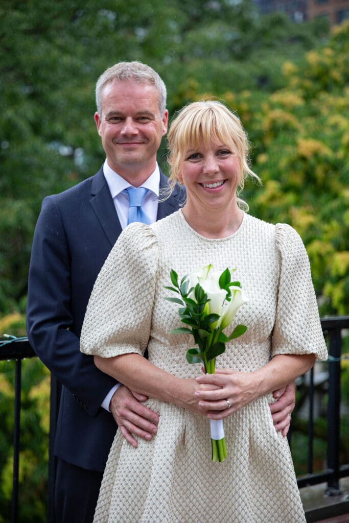 NYC Elopement at the Norwegian Seamen's Church. Bride and Groom pose for photos on rooftop after ceremony.
