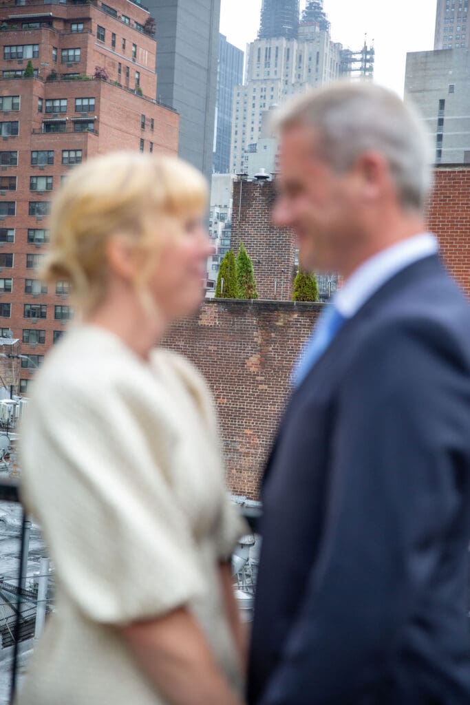 NYC Elopement at the Norwegian Seamen's Church. Bride and Groom celebrate on rooftop after ceremony.