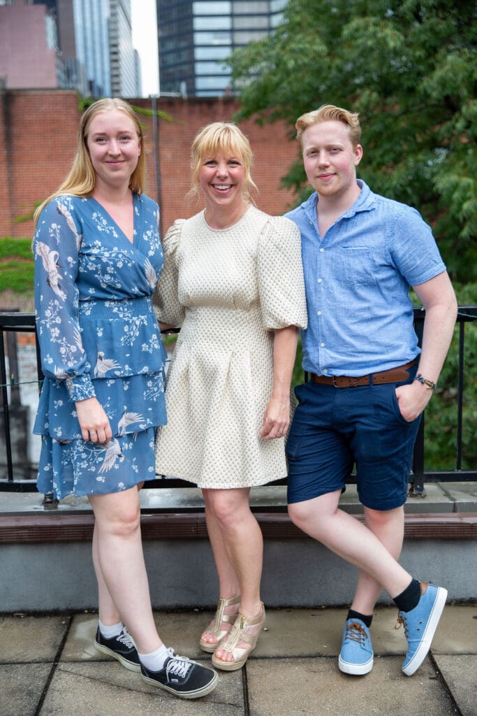NYC Elopement at the Norwegian Seamen's Church. Bride poses with her children on rooftop after ceremony.