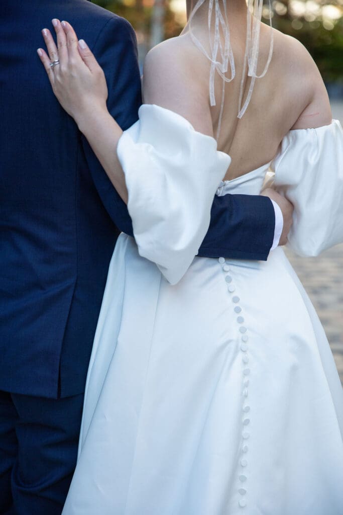 Newlyweds pose for wedding portraits in South Street Seaport in NYC.