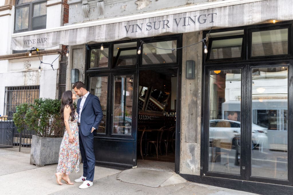 Engaged Couple poses on Manhattan's Upper West Side at Vin Sur Vingt.
