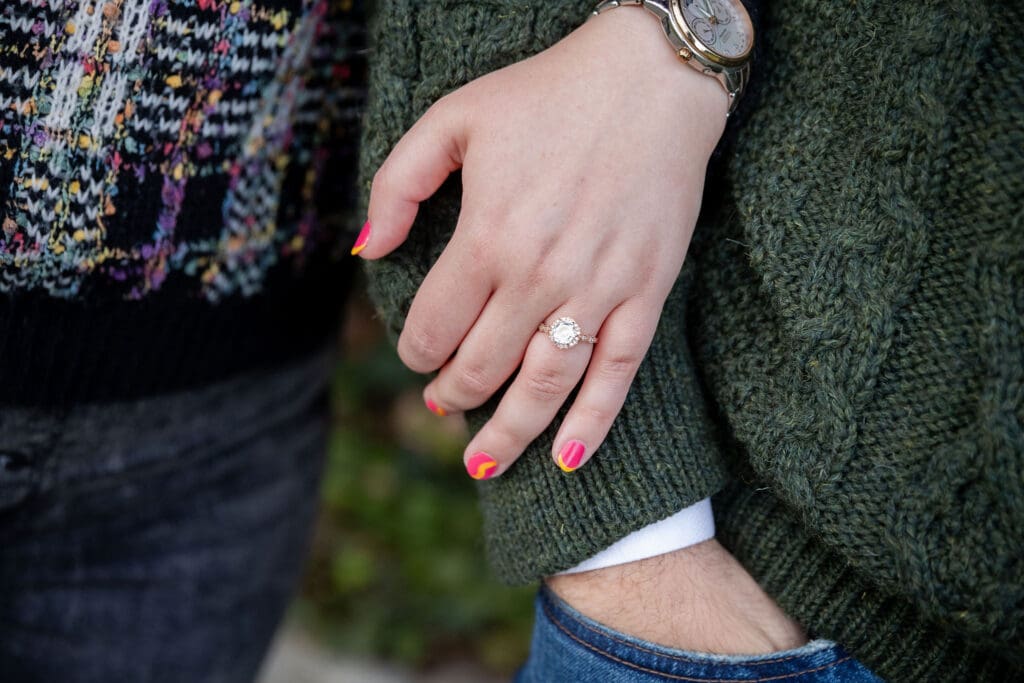 Close up of engaged couple's rings at Socrates Sculpture Park in Astoria, Queens for their fall engagement session.