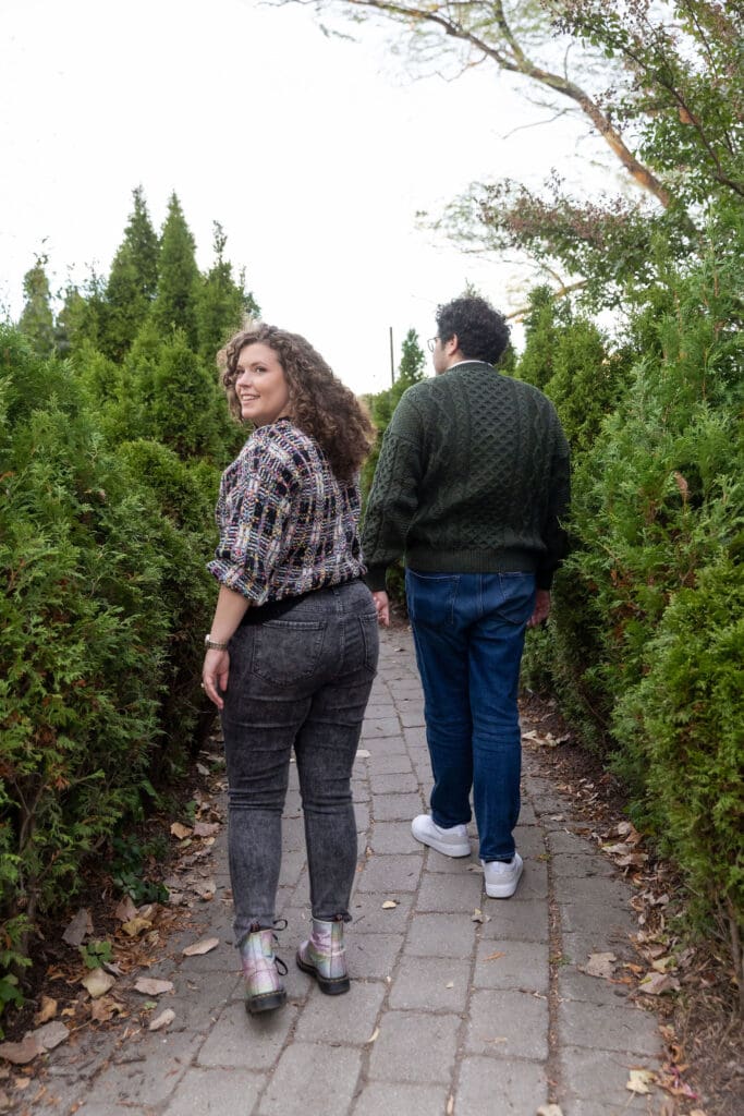 Engaged couple dance at Socrates Sculpture Park in Astoria, Queens for their fall engagement session.